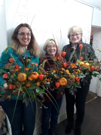 Class of 2019 demonstrating how to make an Autumn Waterfall Arrangement